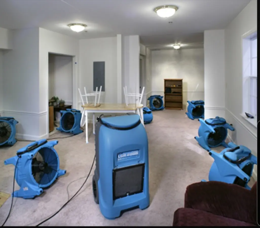 Air movers and dehumidifier setup for Water Damage Restoration in Meredith